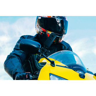 Man on a motorcycle with the Insta360 attached to the handle bars